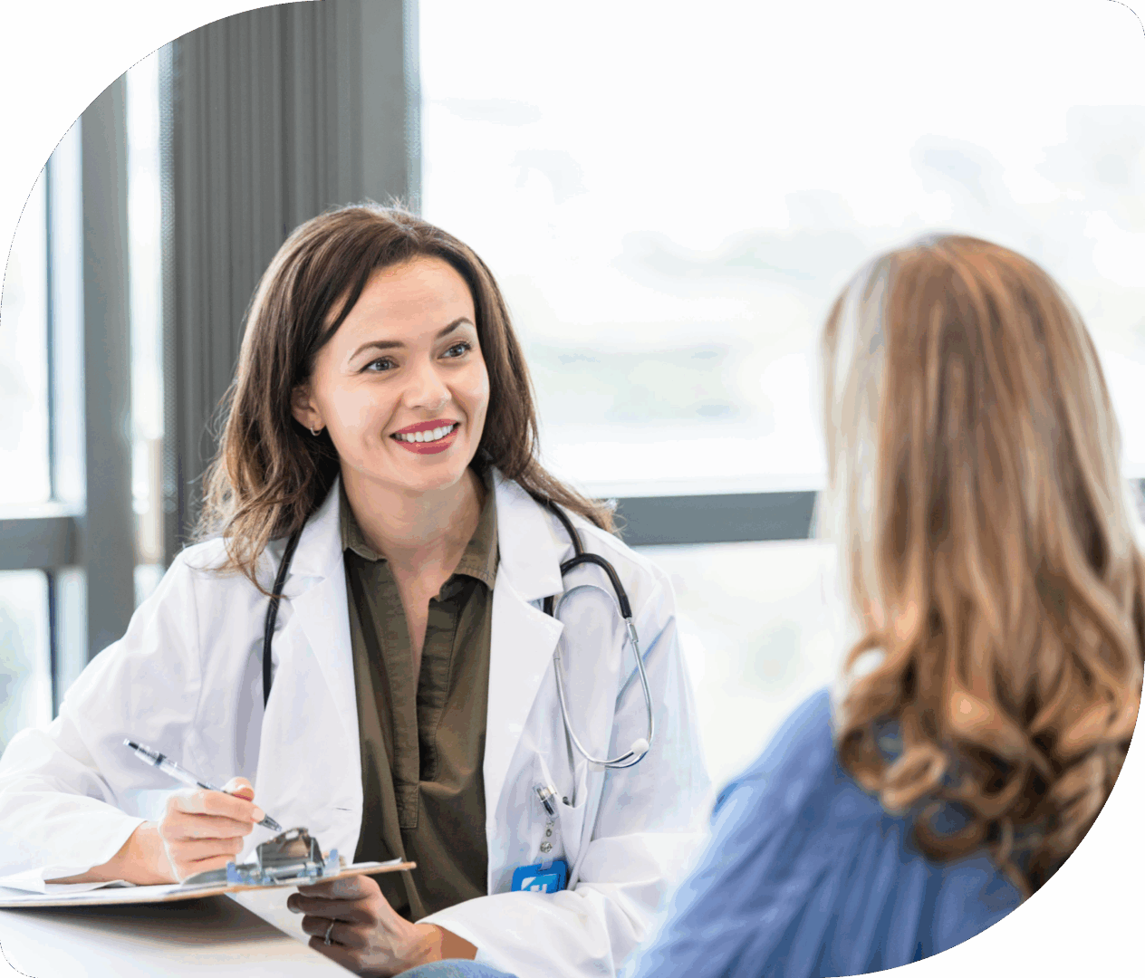 Doctor consulting with a patient in office.